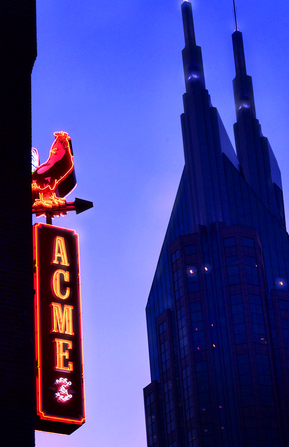 ACME Feed and Seed signage restaurant in Nashville with AT&T Batman building