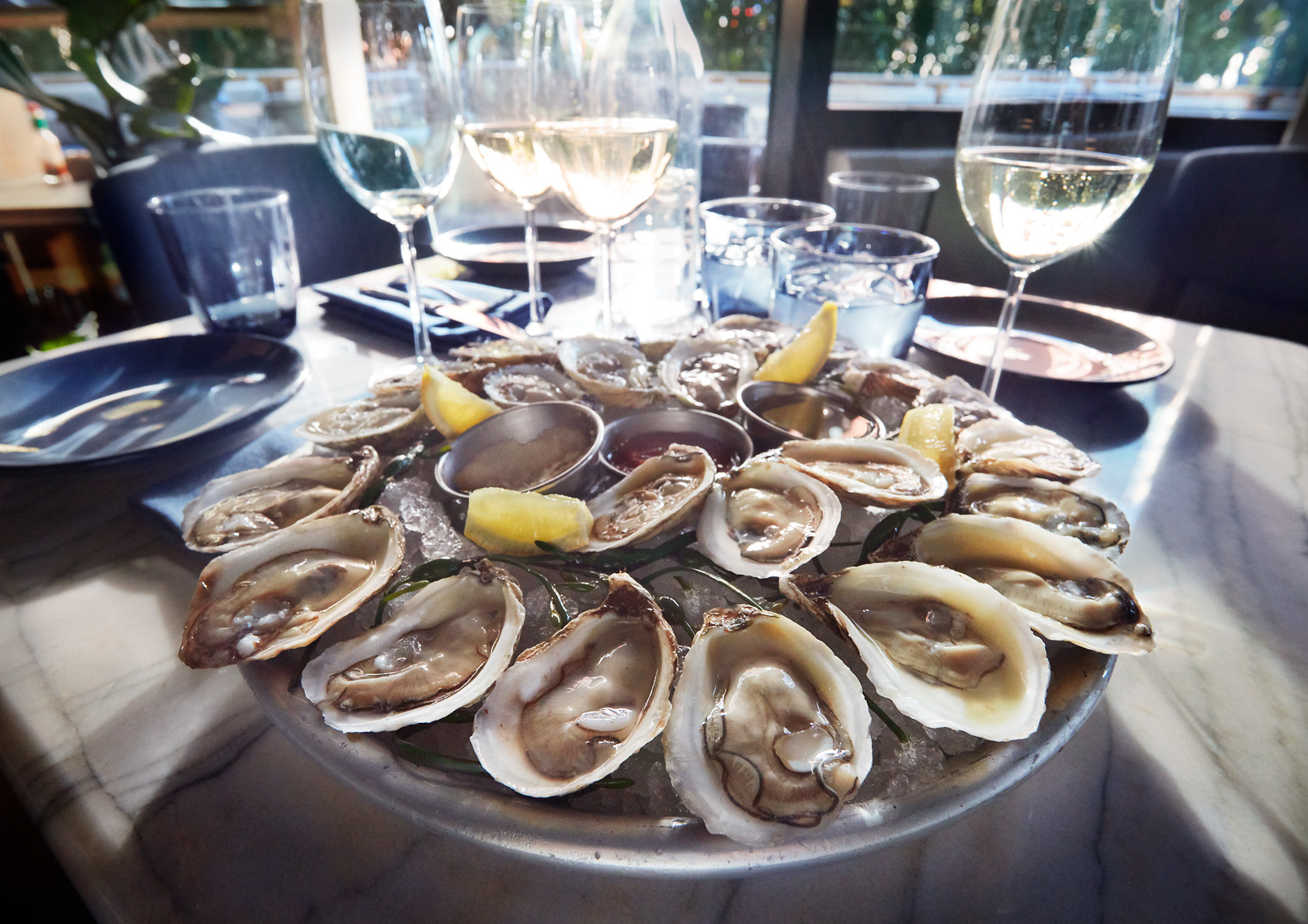 Marsh House Restaurant in The Thompson Hotel. Gulch Nashville. Happy hour raw Oysters . Shellfish