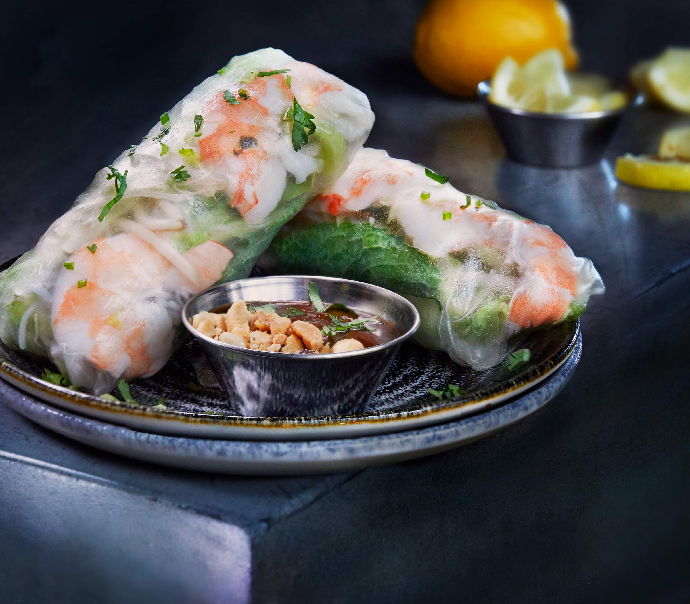 Summer Rolls with Peanut Dipping Sauce-Chilled rice wrap, jumbo shrimp, rice noodles, lettuce, basil, mint, bean sprouts.