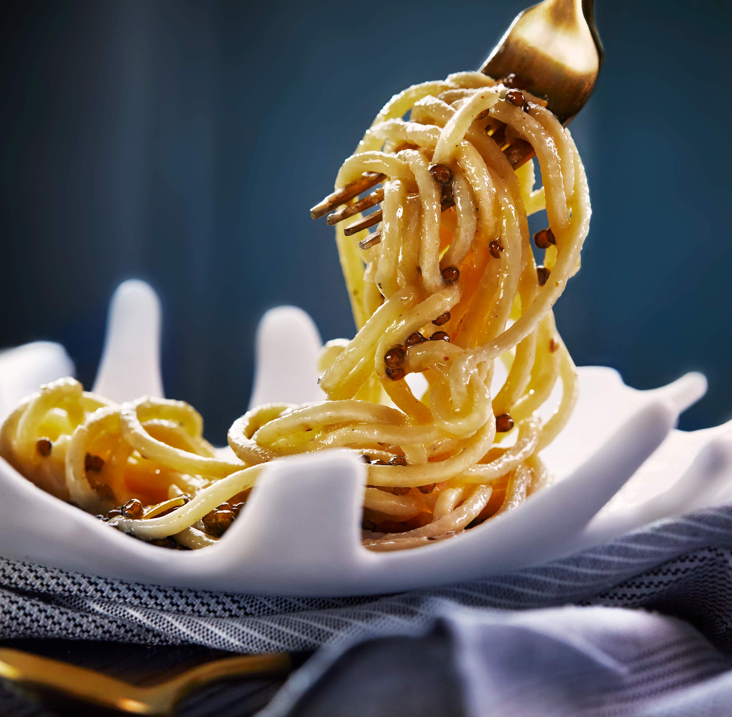 Spaghetti with cultured butter, oyster and burnt calamari broth with Kaluga caviar